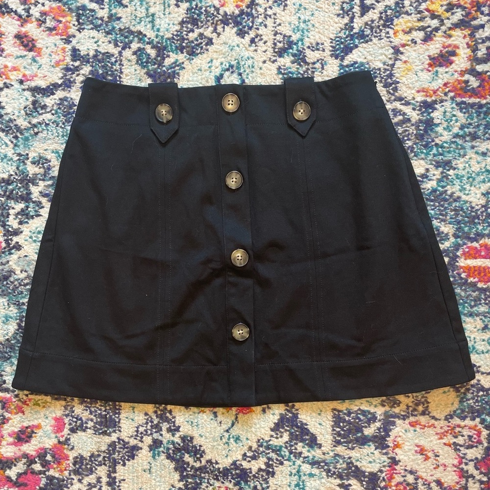 Maeve by Anthropologie NWOT Black mini-skirt with button detail. Size 6.